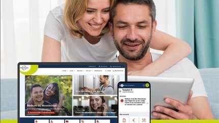 Man en vrouw voor laptop met afbeelding van nieuwe website en app